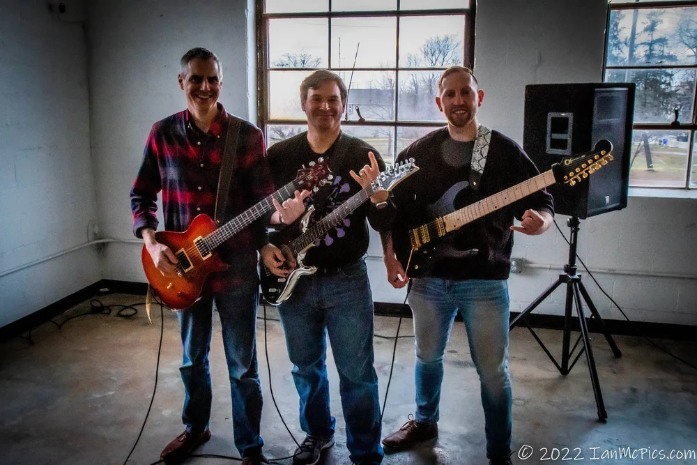 Travis Osterloh and his mentor playing guitar back-to-back