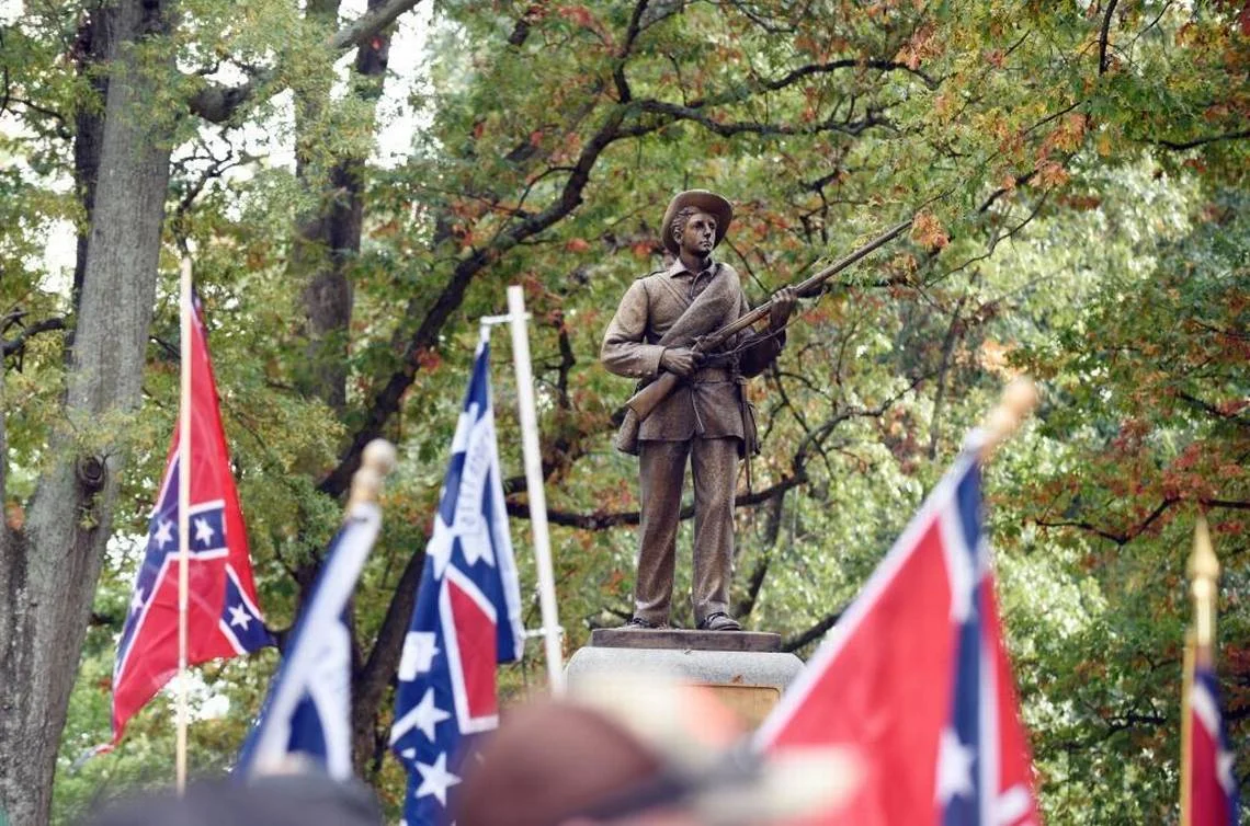 Silent Sam with flags - News abd Observer.jpeg