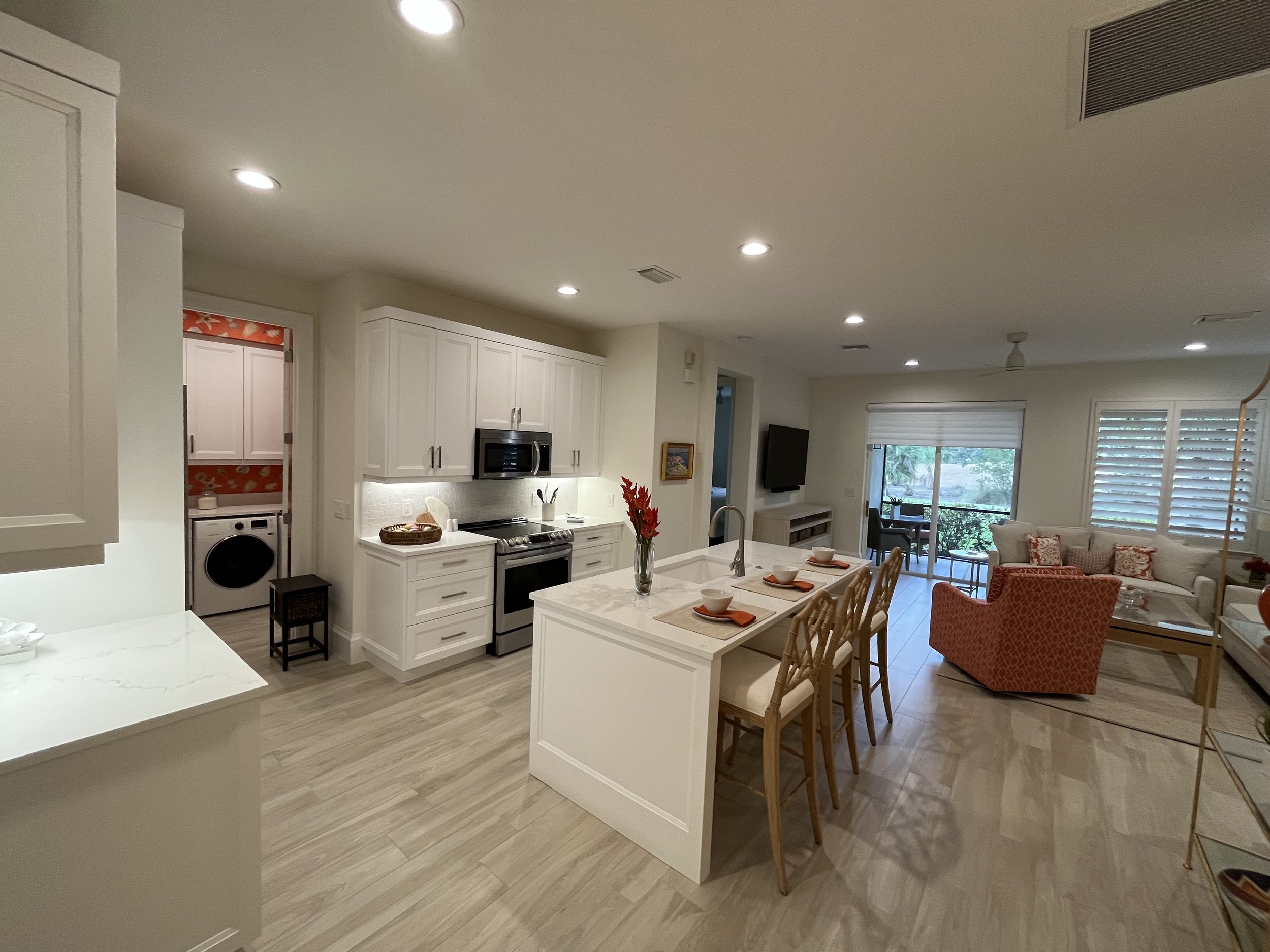 Kitchen - Custom cabinets - Bosch - island - porcelain - backsplash - laundry room - condo living - efficient space - subzero.jpg