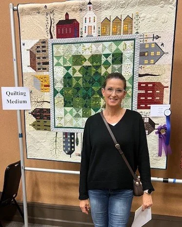 2026 Best of Show winner "Quilted Village" by Nancy Sahrakar