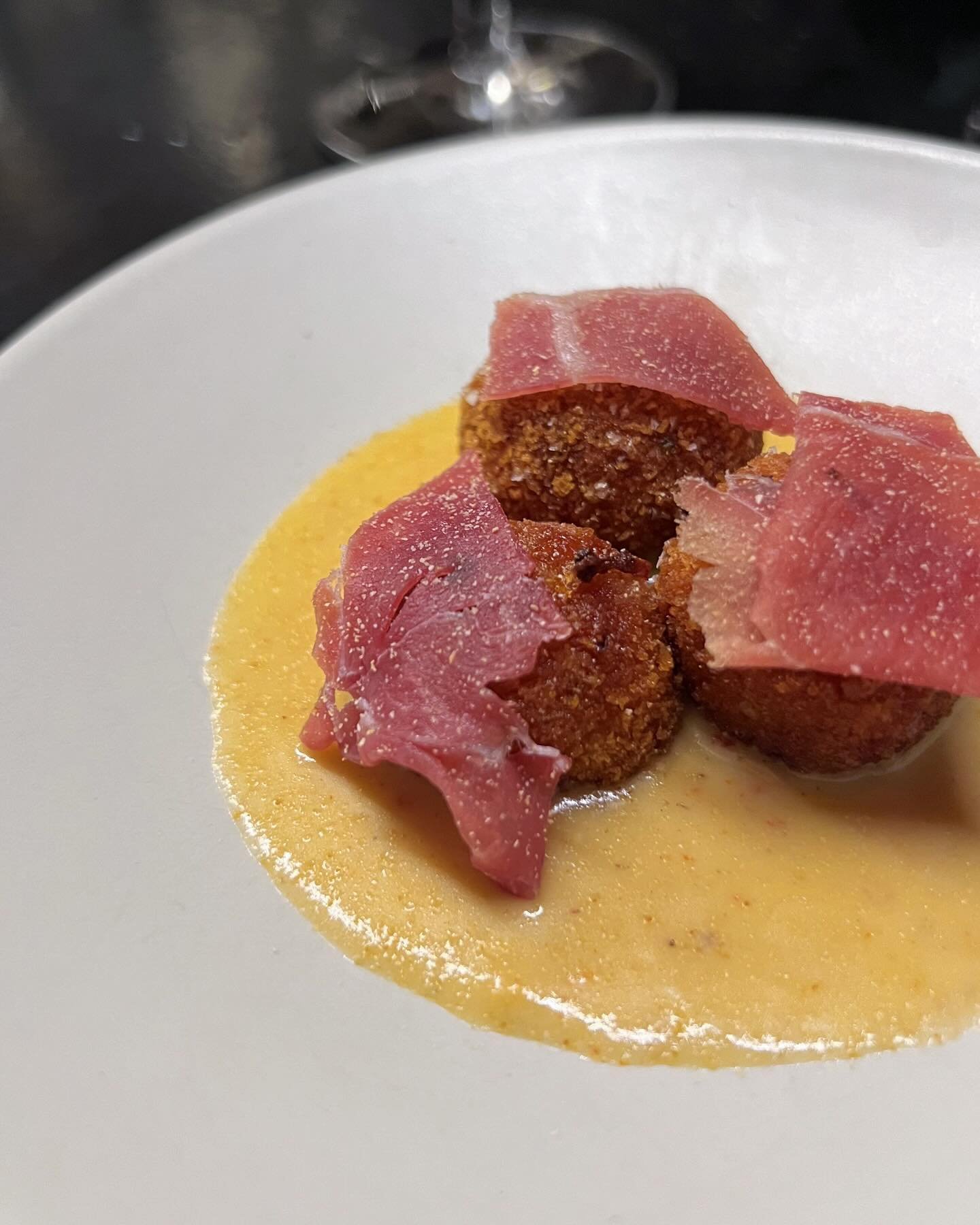 olives covered in pork sausage, breaded and fried, served with a cheese and beer sauce and topped with Broadbent country ham. Sorry for stealing your photo @mattmorrisfilms we love you.