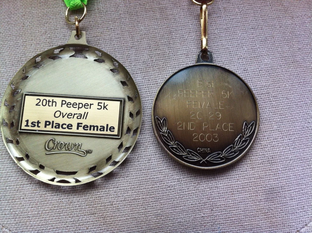 My medal from Saturday on the left and my medal from 2003 on the right.