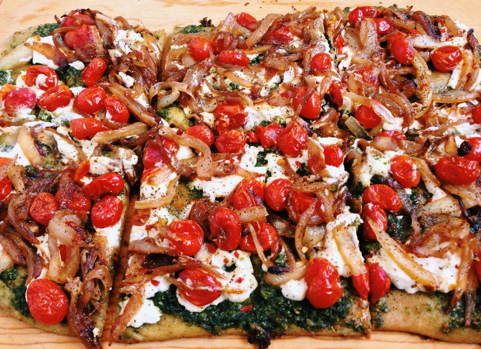 Goat Cheese Pizza with Caramelized Onions and Pesto