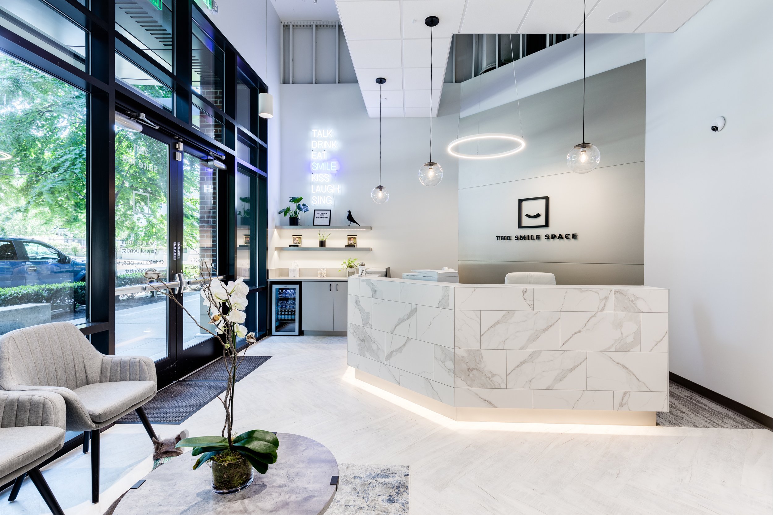 Modern reception area at The Smile Space, a boutique dental and orthodontic practice in Belltown, Seattle.