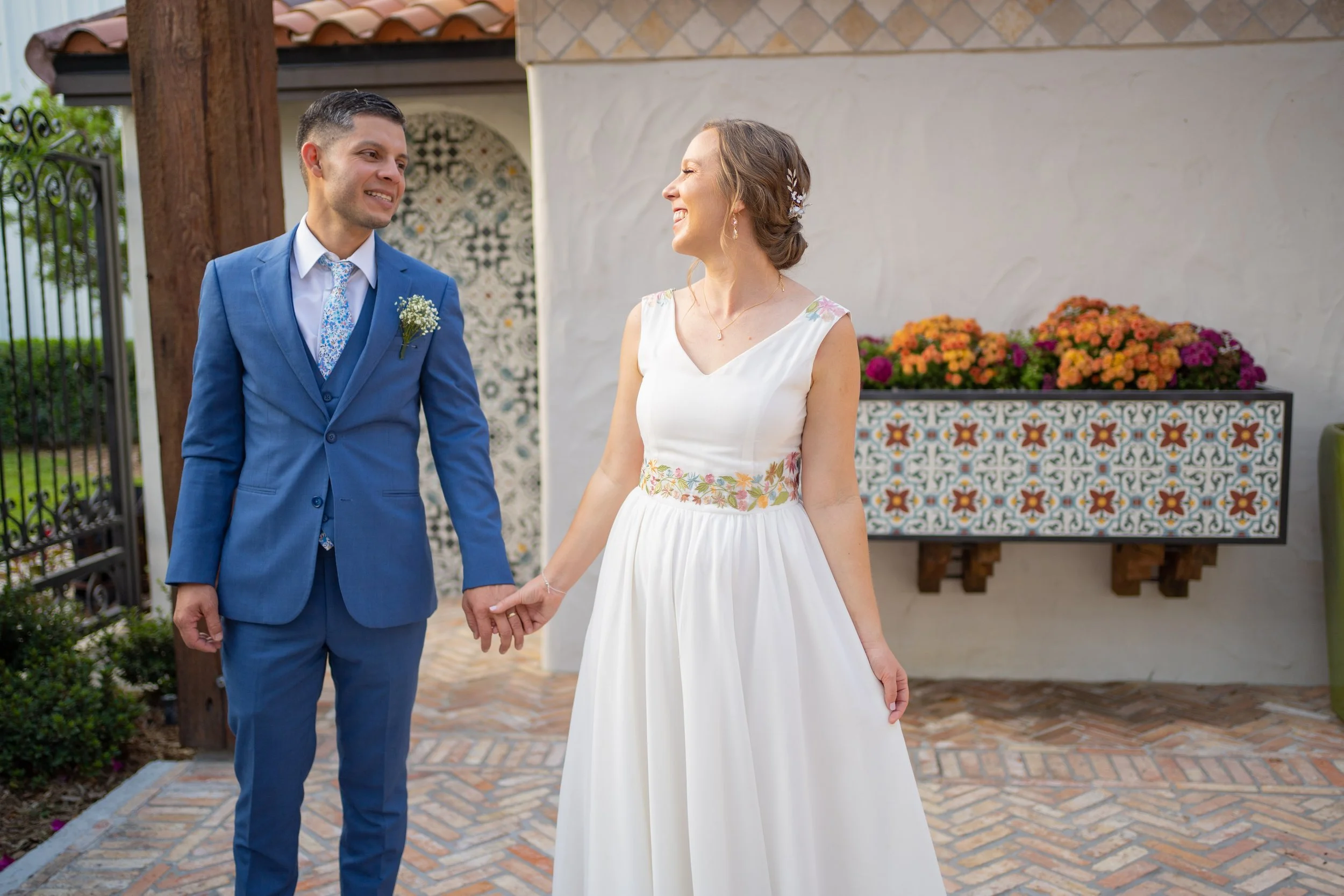 Bride and Groom holding hands