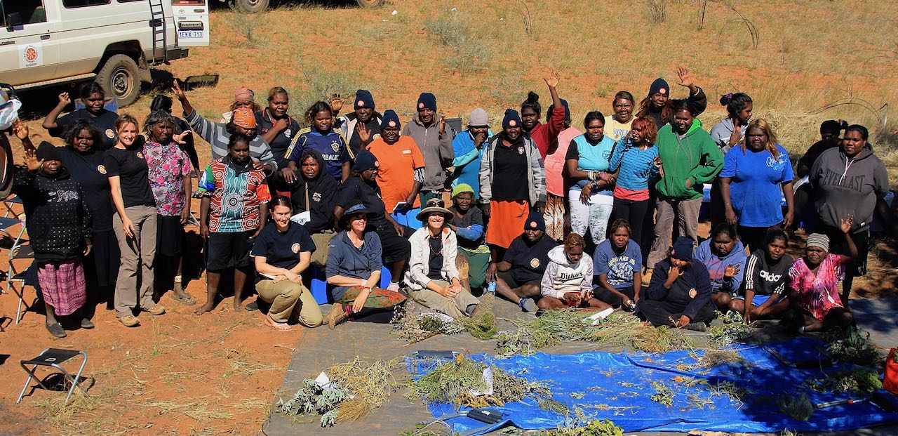 Forty-five Martu women and six other staff of Kanyirninpa Jukurrpa conclude a week-long camp near Parnngurr. Fiona has worked with some of these families across four generations (KJ 2015).