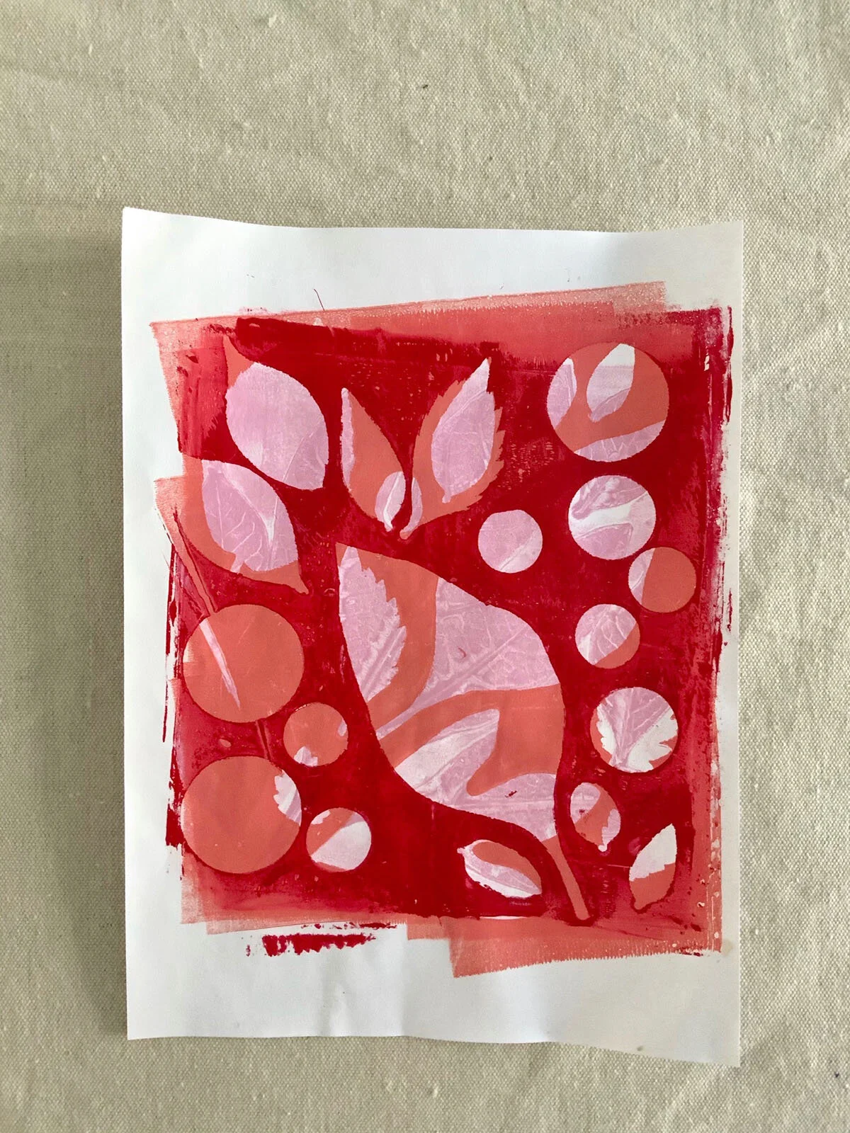 Gelatin printing with analogous colors. Made using leaves, paper circles, and tempera paint. The layers reveal the colors underneath and the graphic quality of the negative and positive space.