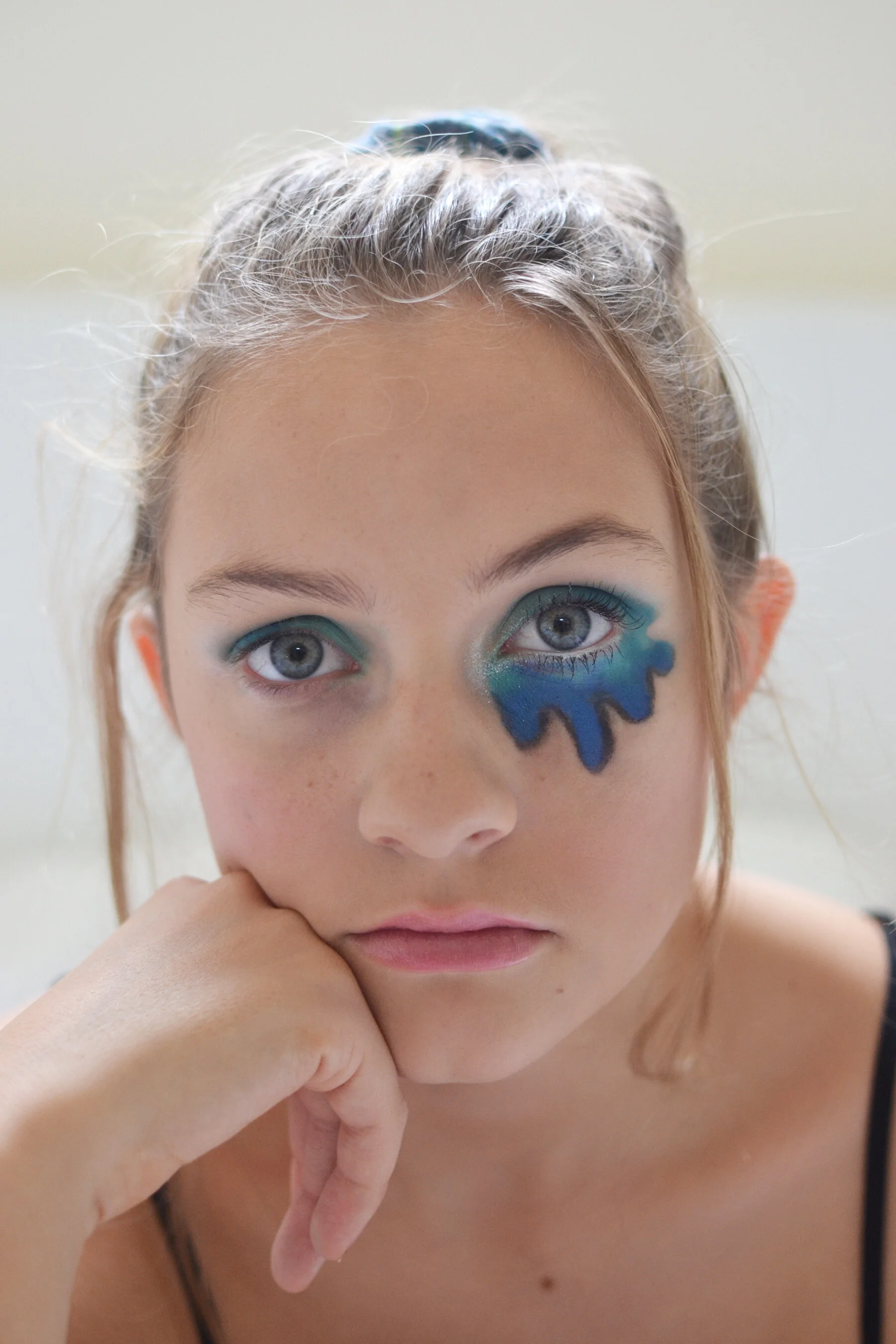 “Right person, wrong time” - Creating a “drip” like effect on one side of the face to express a sorrowful mood. Materials used: face paint palette, shadow (shimmer, matte, mild), and basic foundation.