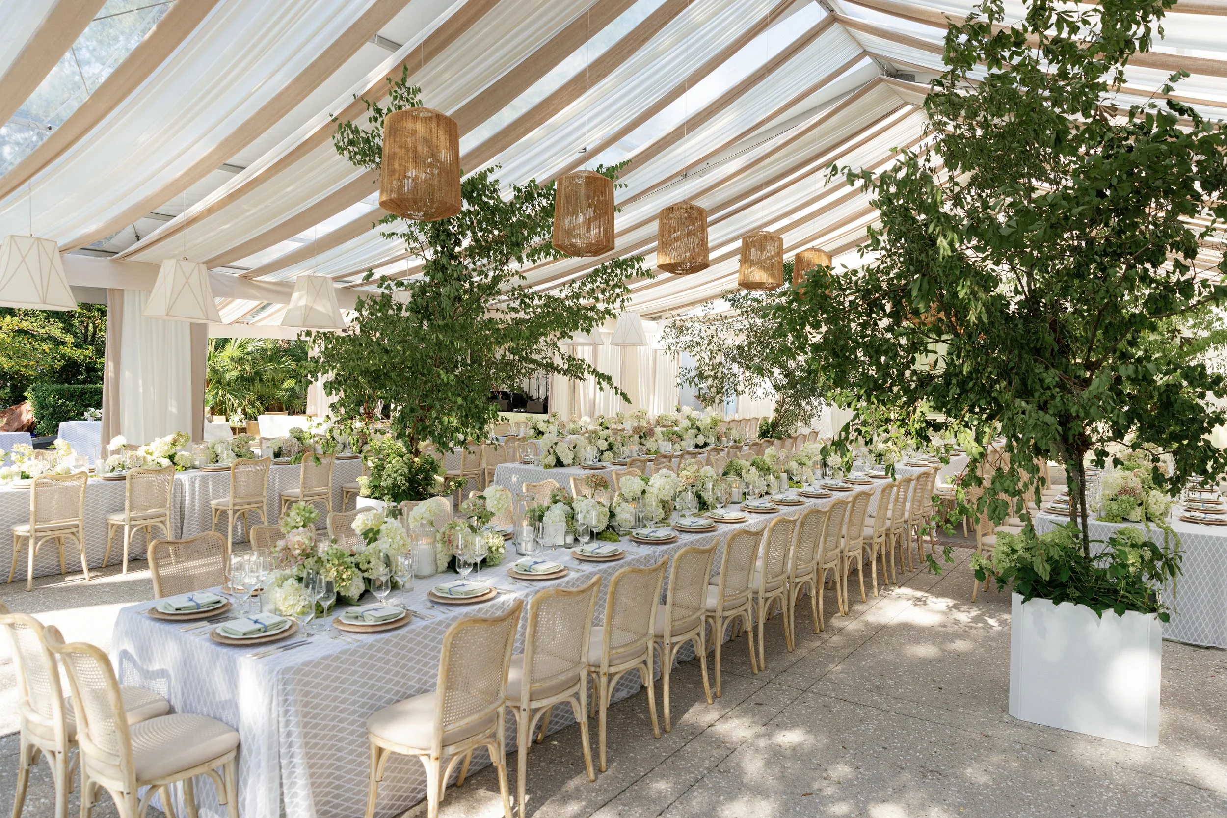 Elegant wedding reception table with green and white florals at Lowndes Grove.