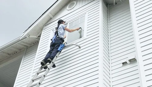 Clearly Windows technician cleans windows