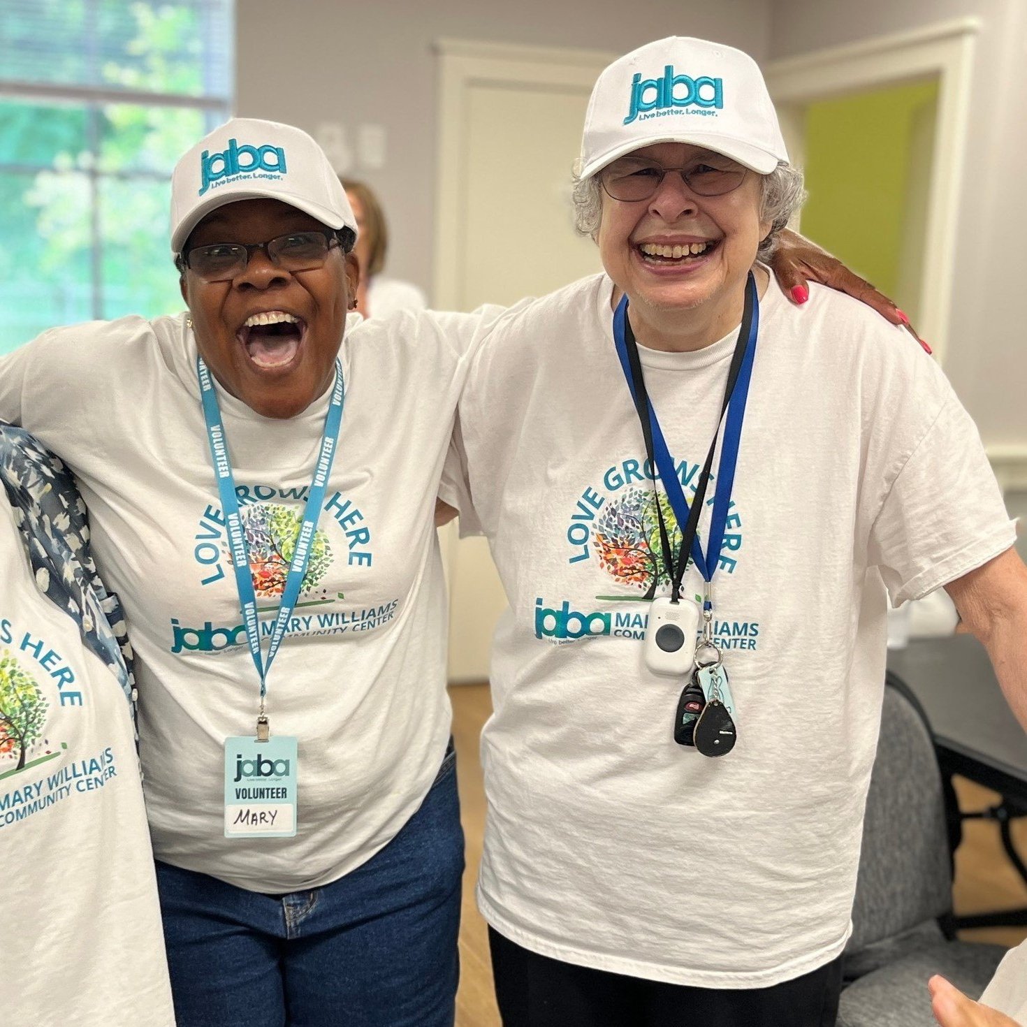 two members of the community center smiling