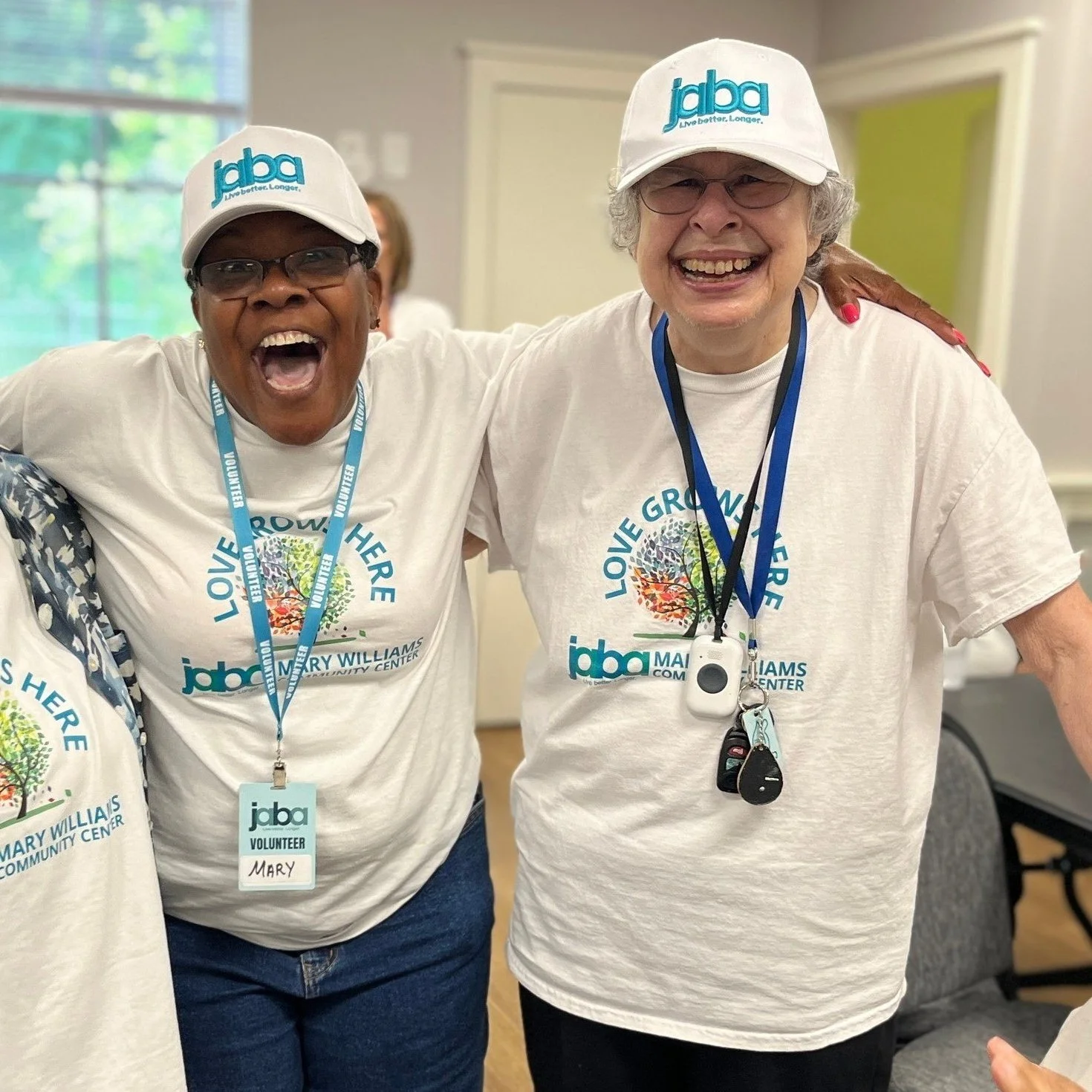 two members of the community center smiling