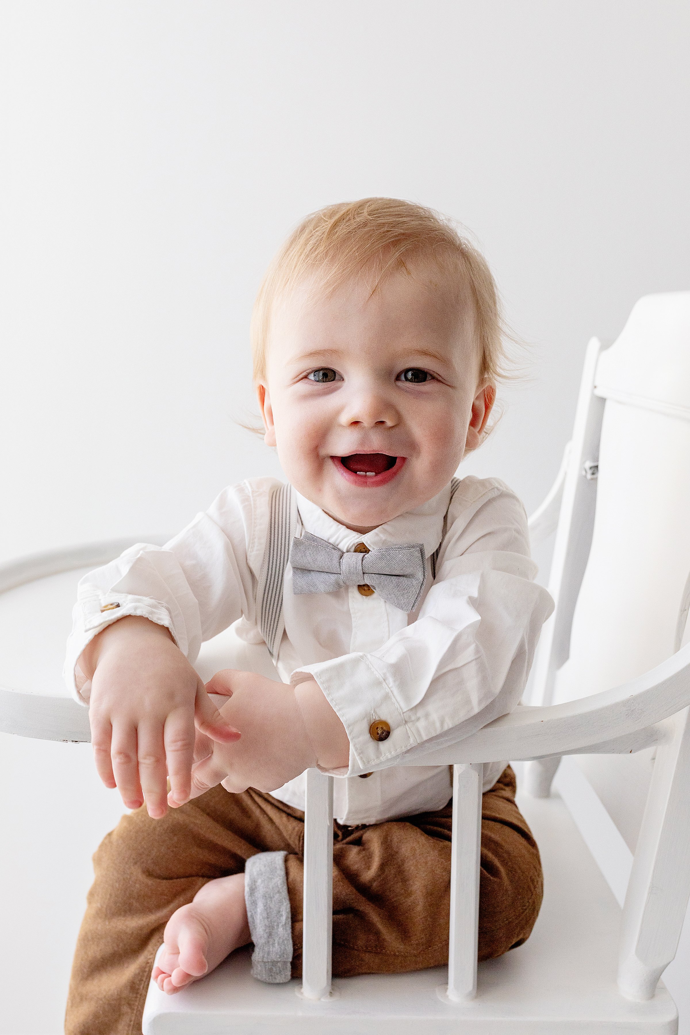 Baby Boy Smiling in Vintage High Chair