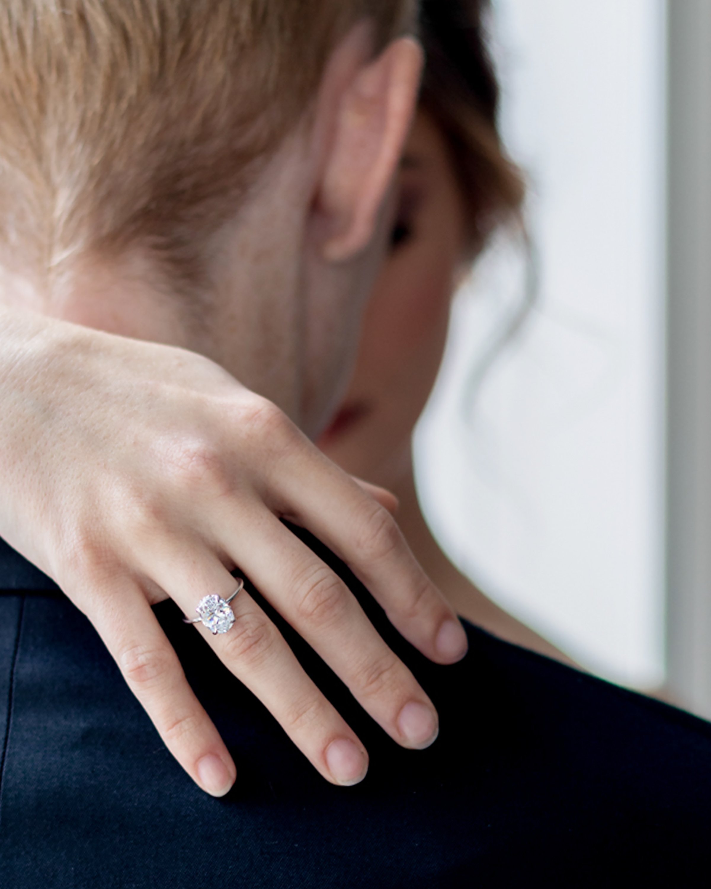 Ring shot on Grooms shoulder