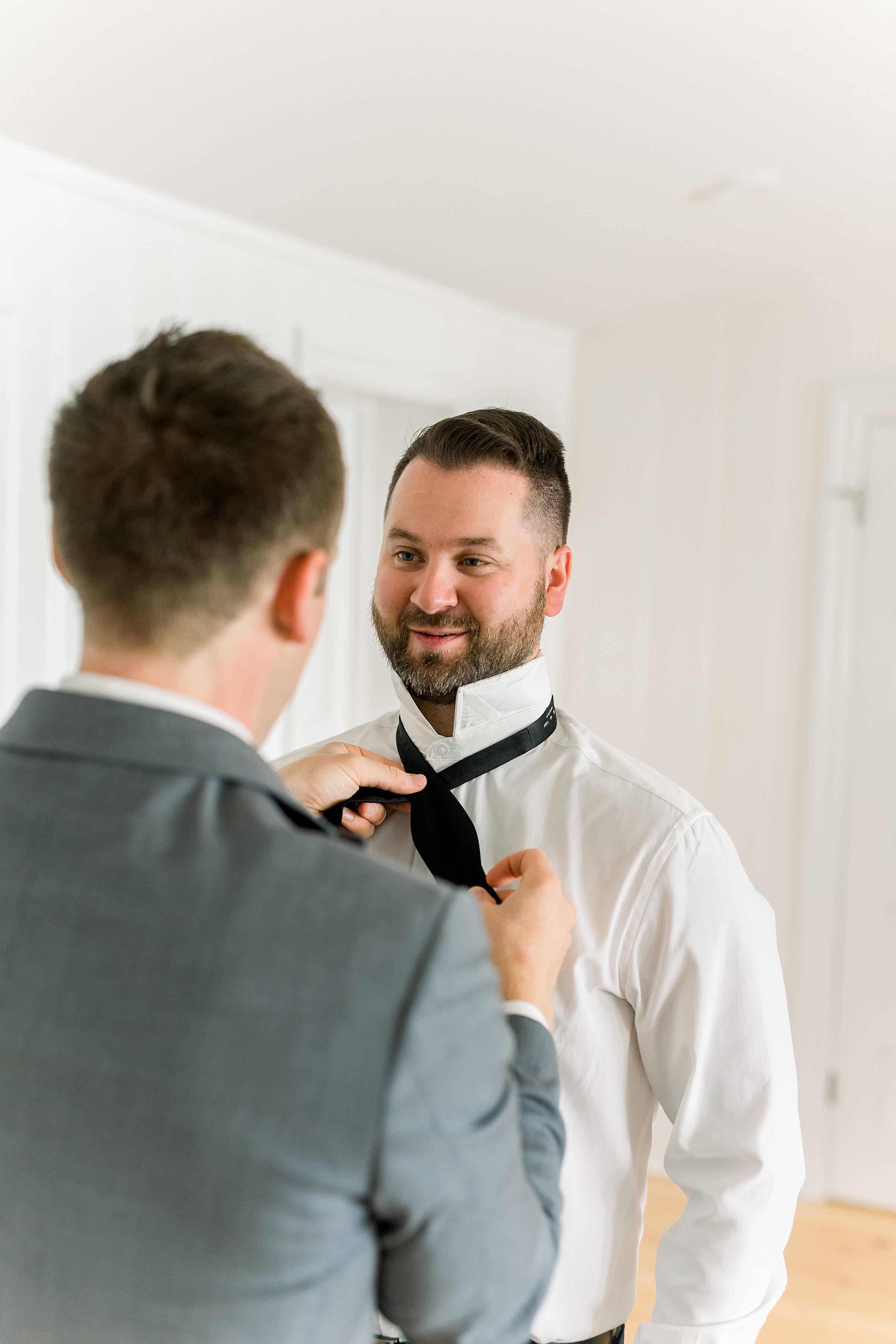 Best man and Groom getting ready