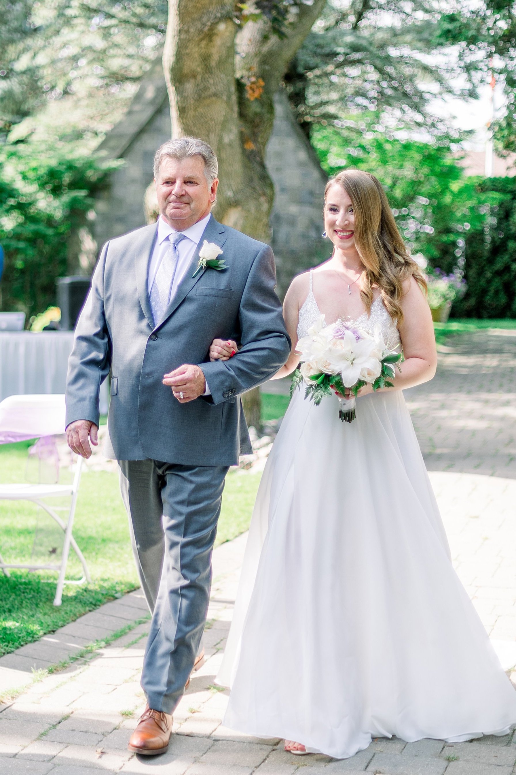 Father walking daughter down the aisle