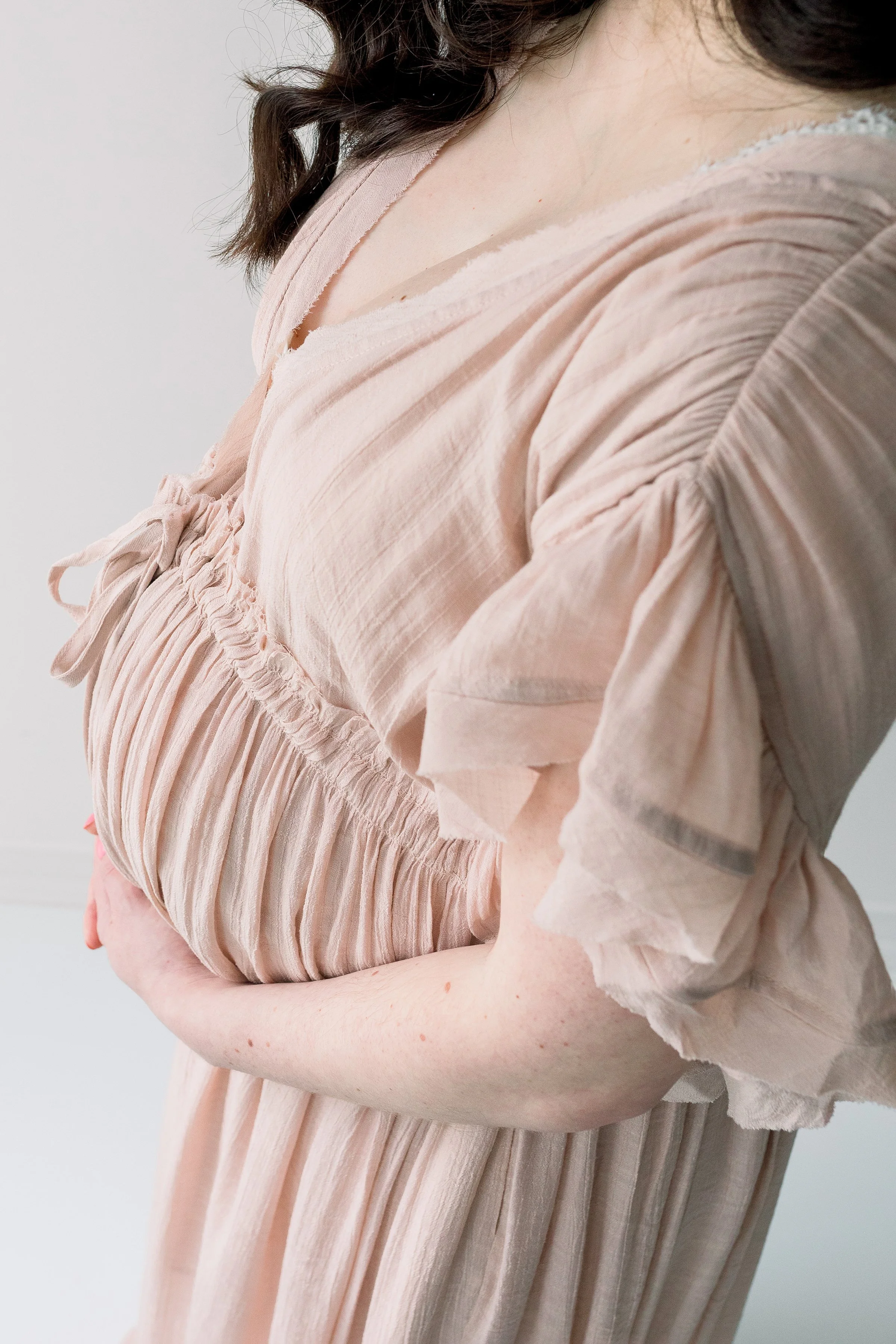 Expecting mom to be in blush dress in Durham Region studio