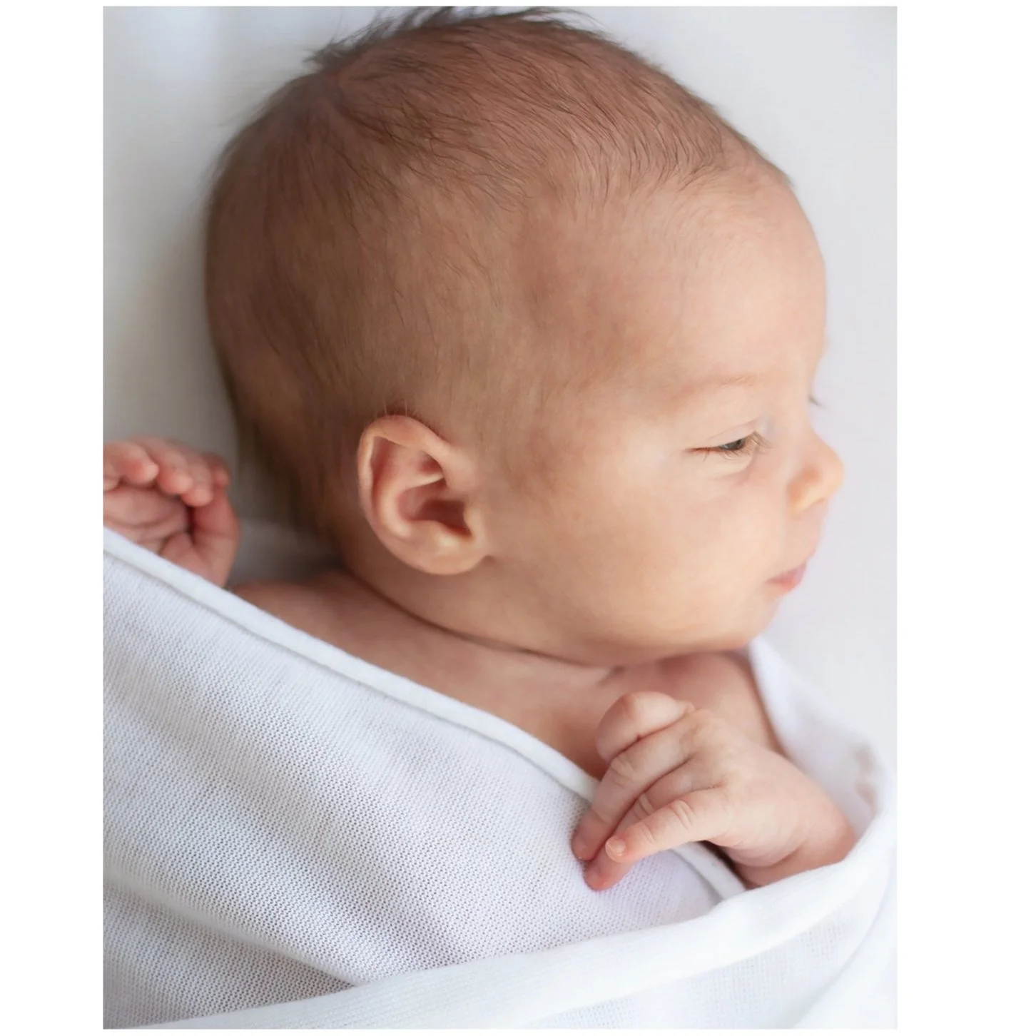 Newborn photography Oshawa neutral wrapped baby