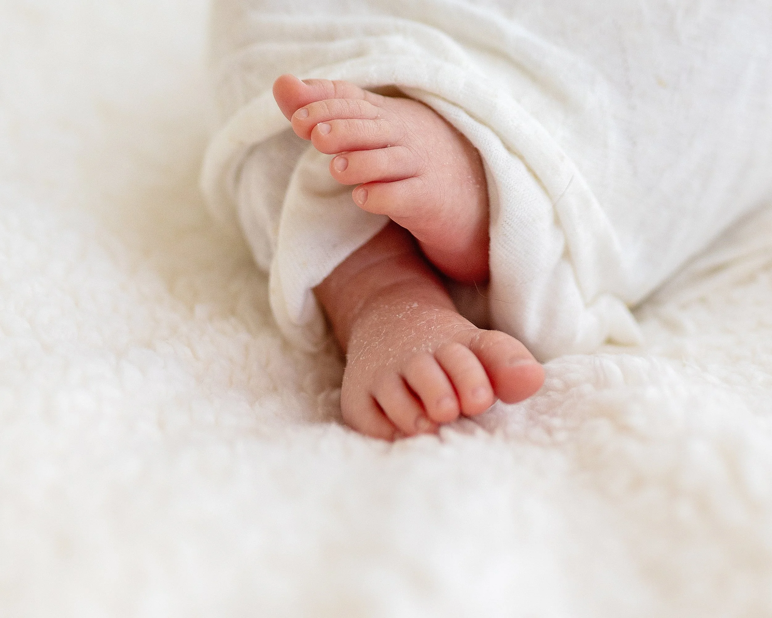Close up of baby feet during newborn session in Oshawa studio