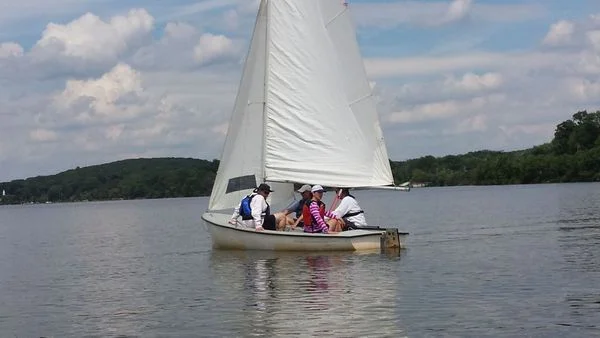 Learning to sail one of our sloops.