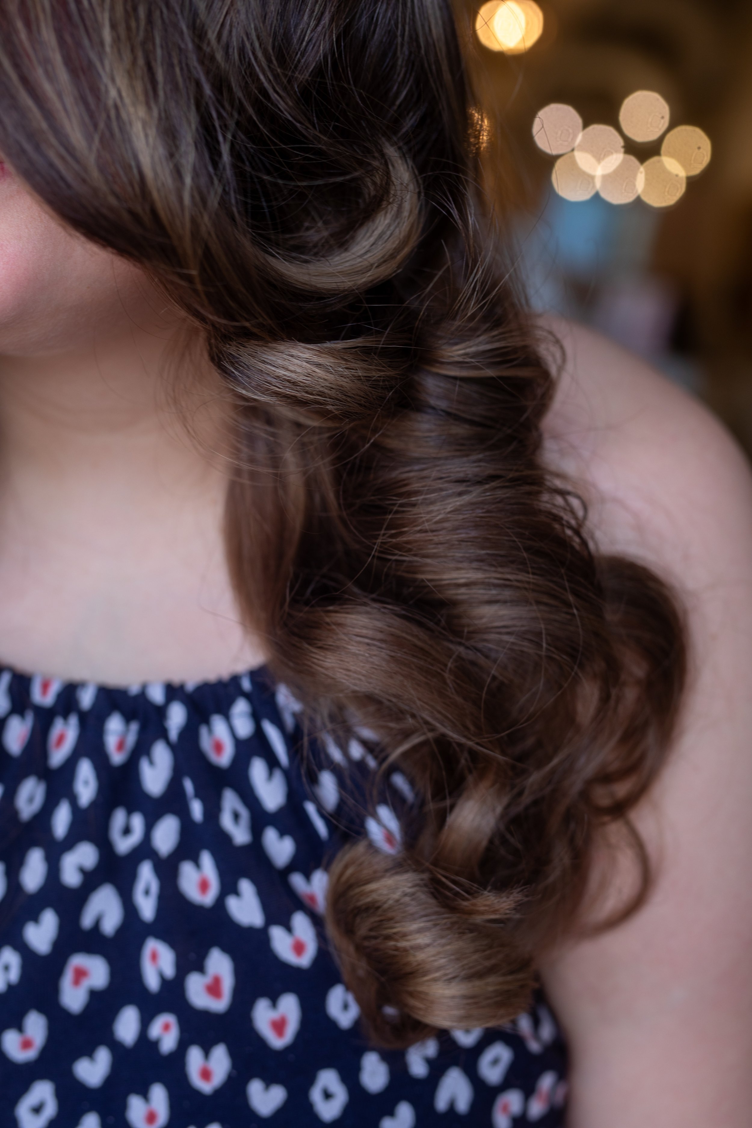 Dimensional brunette color result showing visible tonal contrast at Alchemy Park