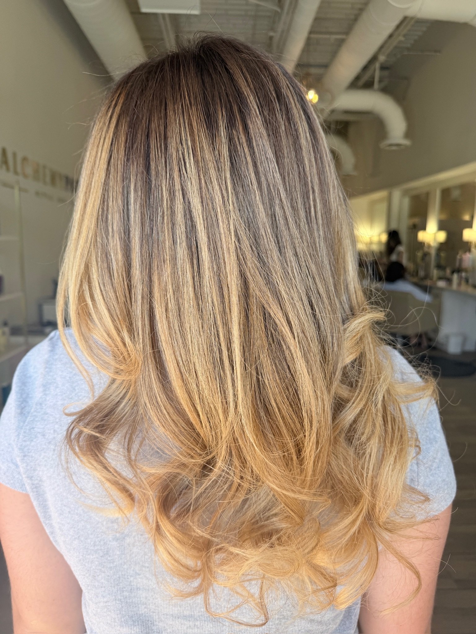 Freshly refreshed lived-in color result at Alchemy Park Style Bar