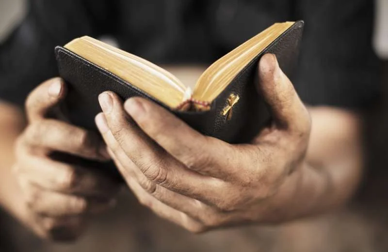 man_holding_bible_0.jpg