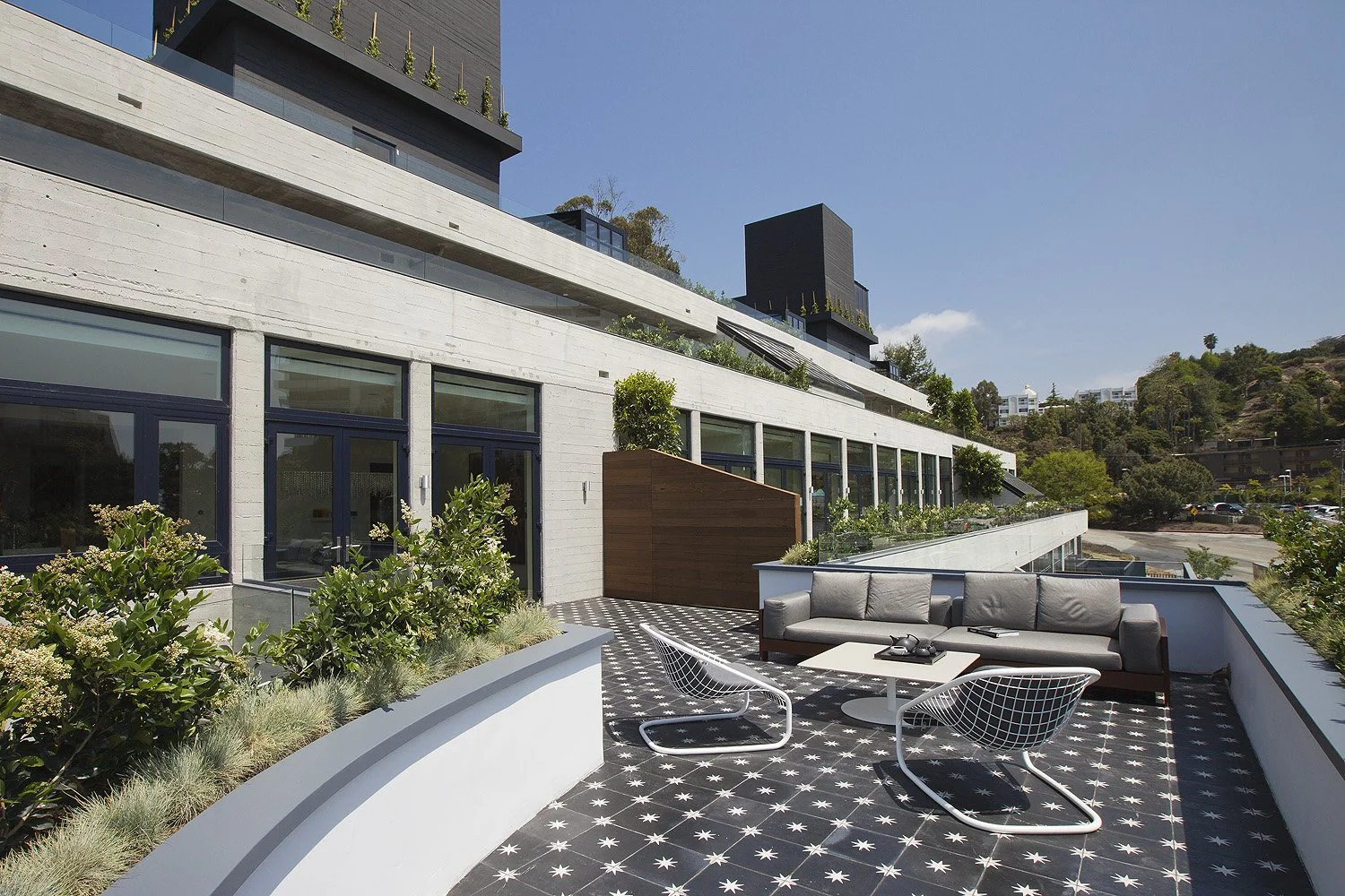 Outdoor terrace of Brutalist modern residence by SUBU Design Architecture