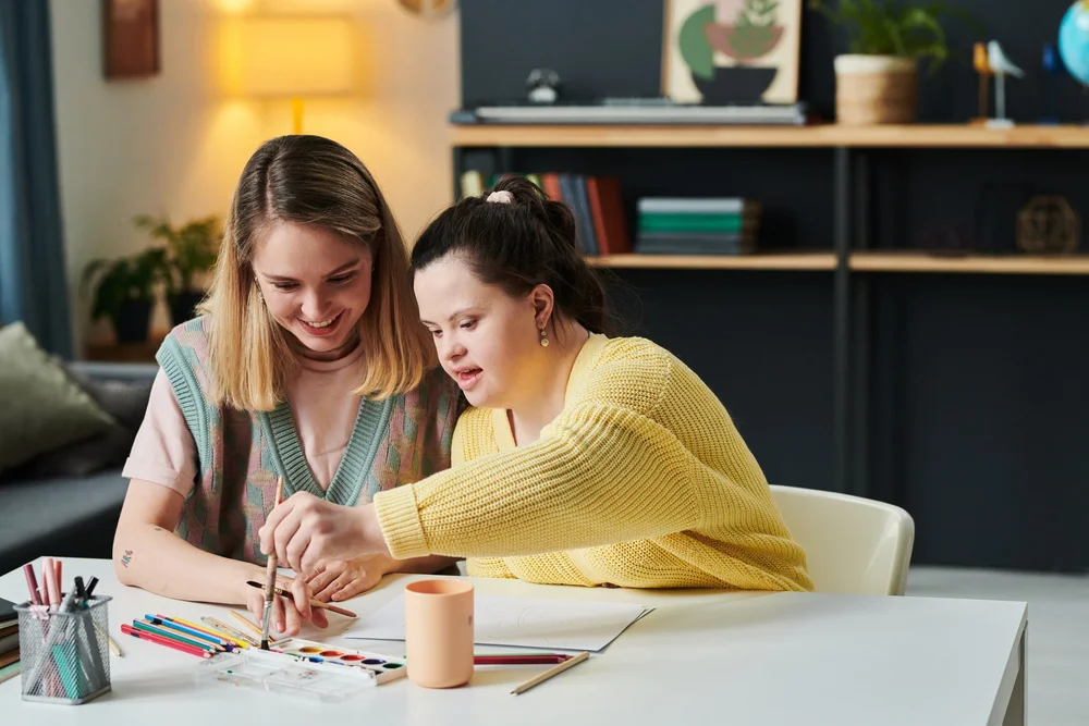 A Positive Moods practitioner working alongside a participant