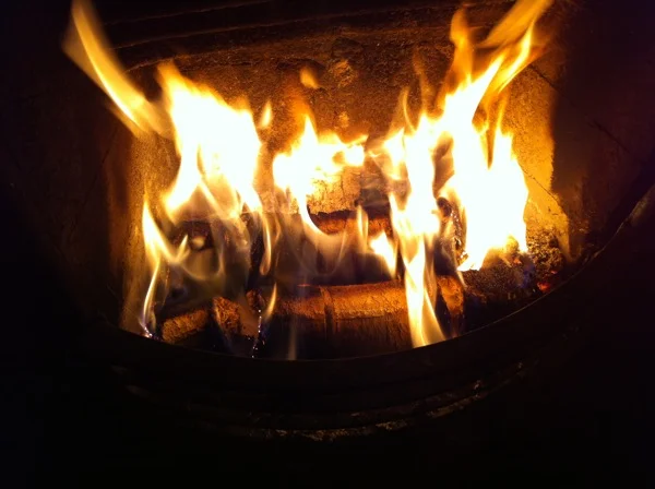 Cambridge Hotlogs burning on an open fire
