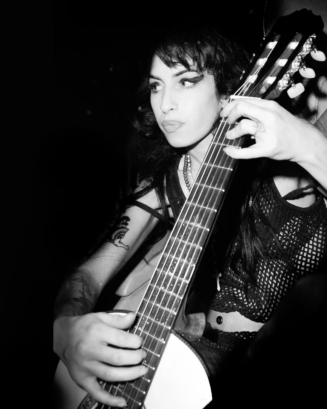 “I often heard Amy rehearsing, but never at a gig. Here she is messing with a guitar in a car (the photo taken through the window). “ -Eddie Vanderwalt, photographer Taken on May 15, 2008