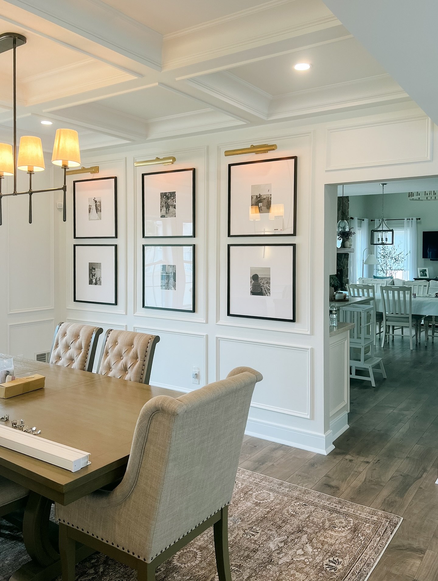 Went back to hang the photos in this formal dining room and wanted to share the final result. The picture frame molding, window trim, columns and coffered ceiling really elevated this room!