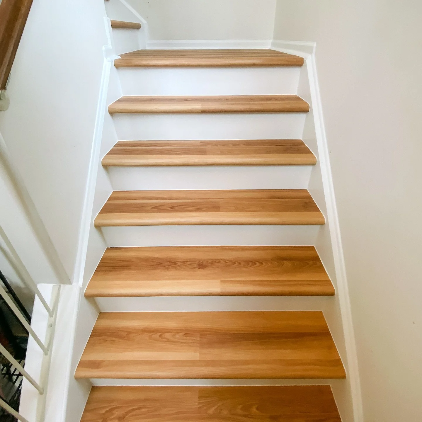Troy and Alex installed LVP flooring throughout a second level home.  The stairs were previously carpeted so they custom wrapped the stairs in LVP which matched the downstairs hardwood perfectly!