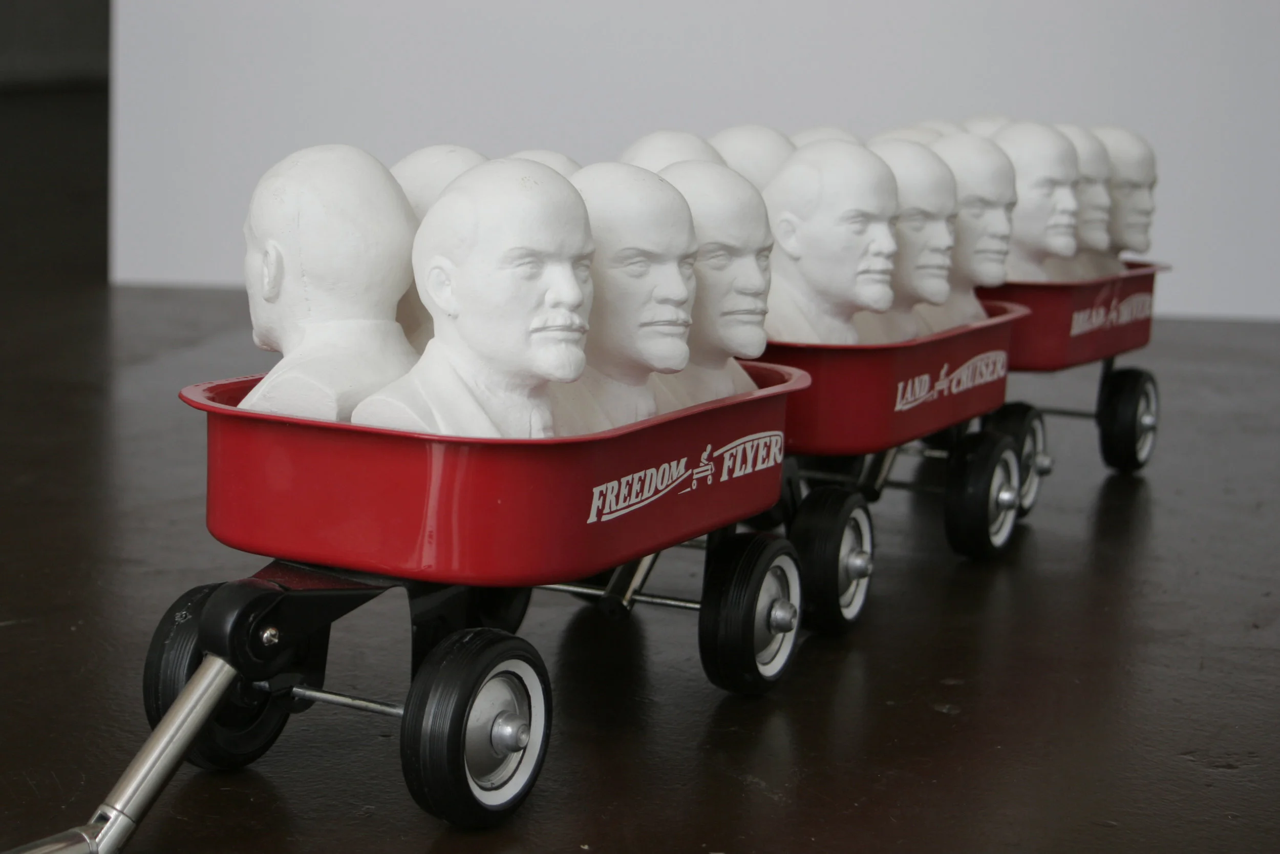 Cargo , 2004. Plaster casts, and ready made with vinyl transfer. 8 x 12 x 42 inches