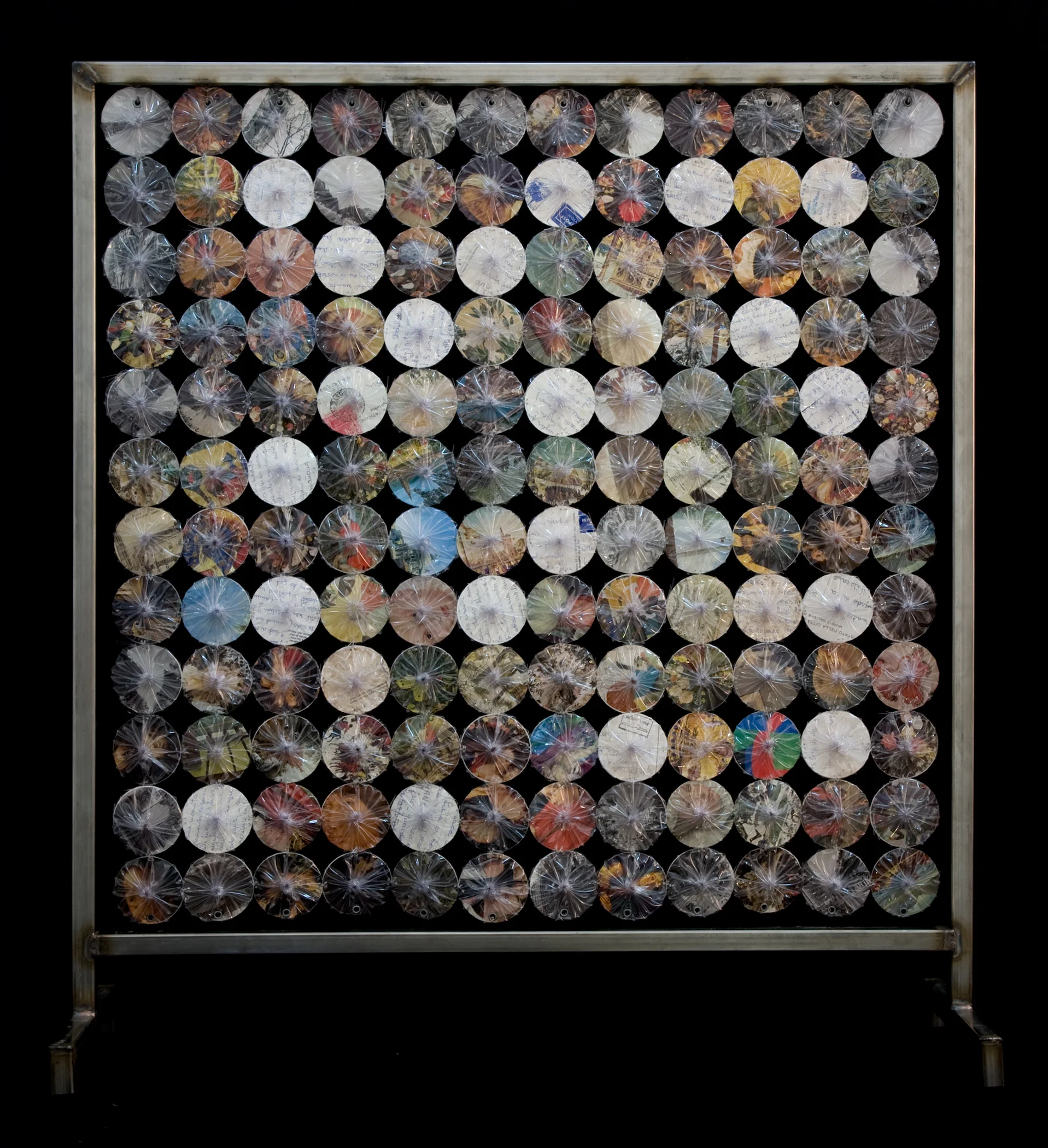 Elsa’s travels , 2009. Travel postcards, and vinyl on metal tubing stand. 24 x 26 inches.
