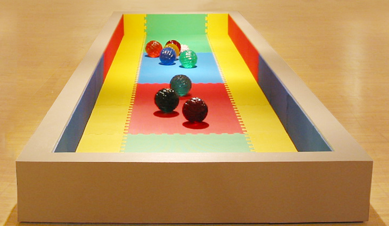 Provocation , 2003. Cast resin spheres, wood, and rubber matting. 4 x 16 feet x 8 inches.
