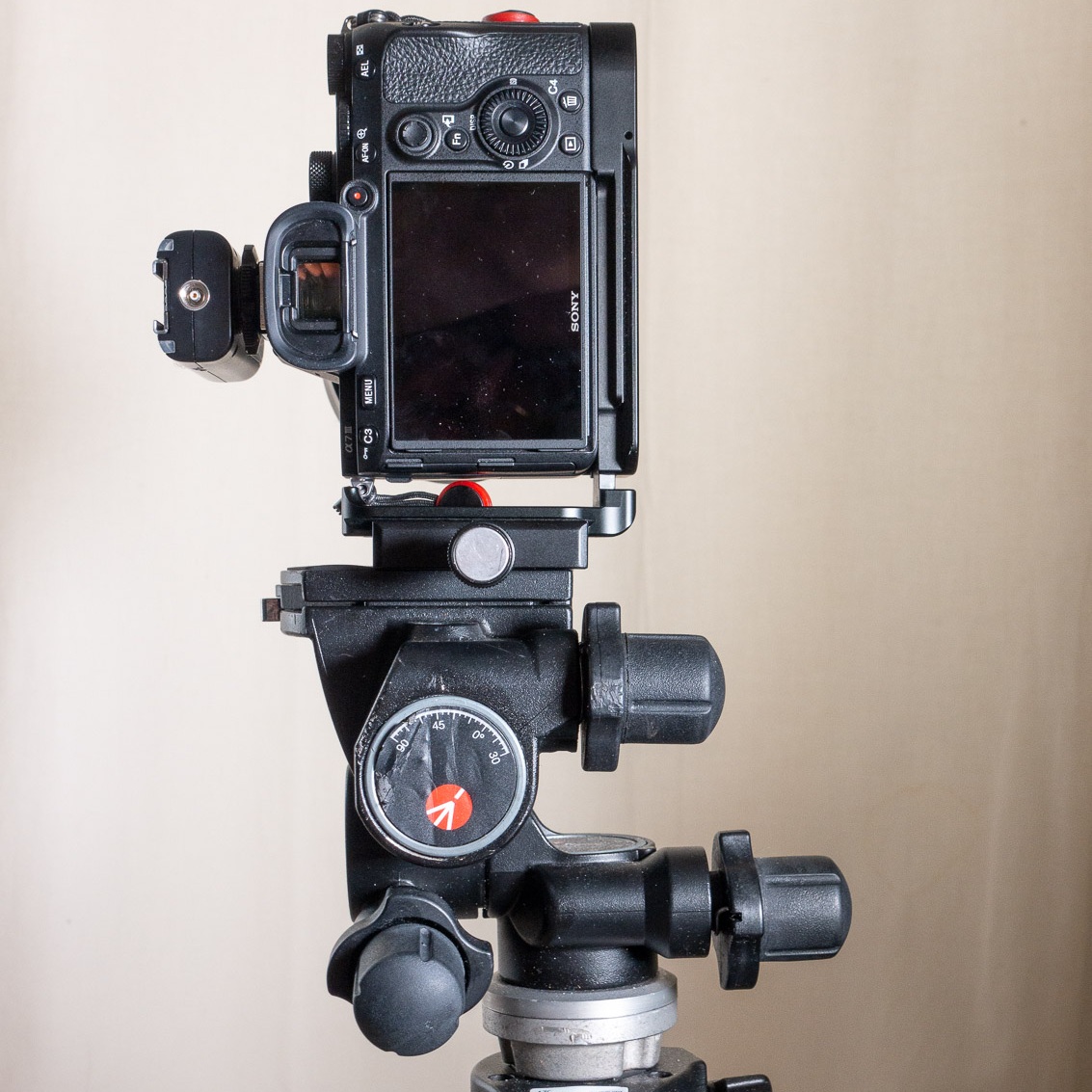 When using an L-Bracket, it’s much easier to get a portrait orientation with the camera and tripod head centered on the tripod.