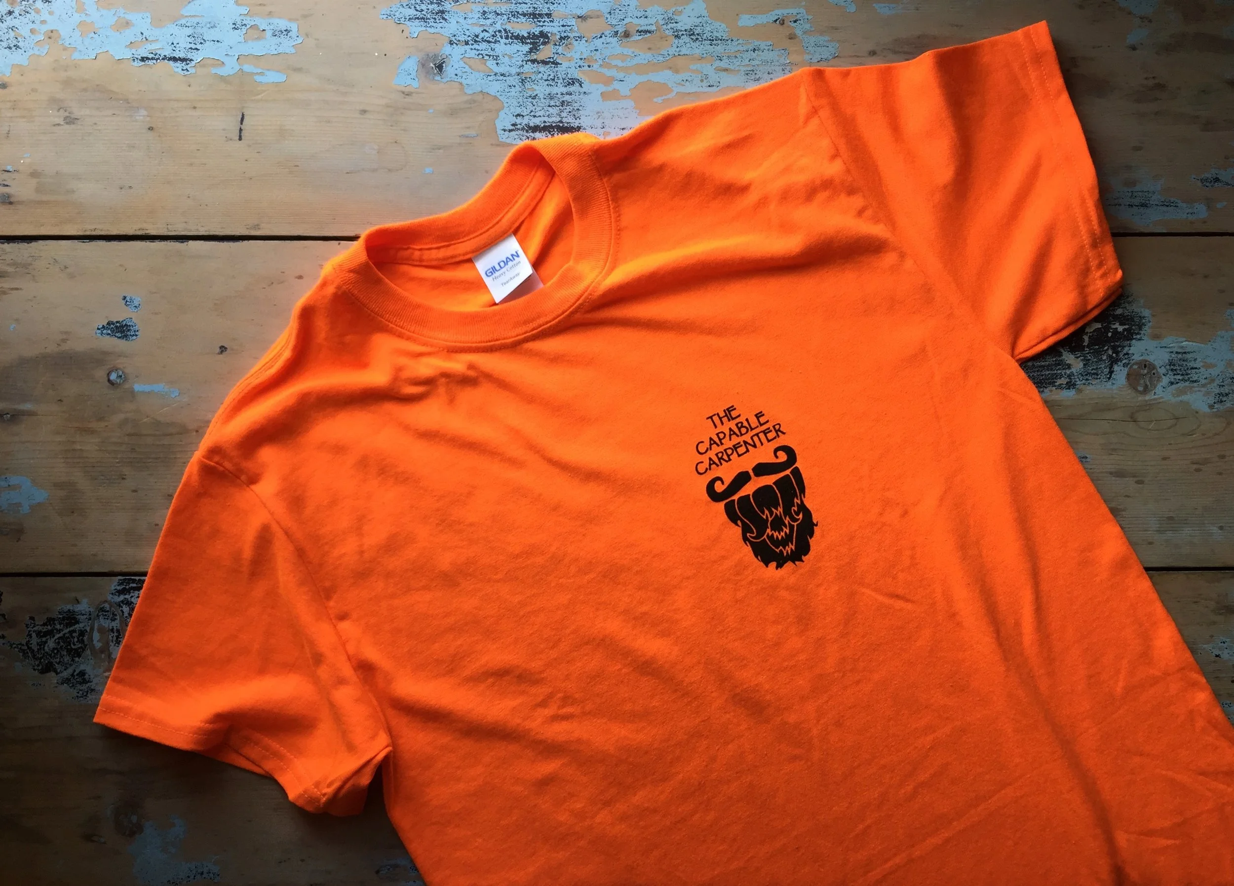 Safety Orange t-shirt with black logo print on front