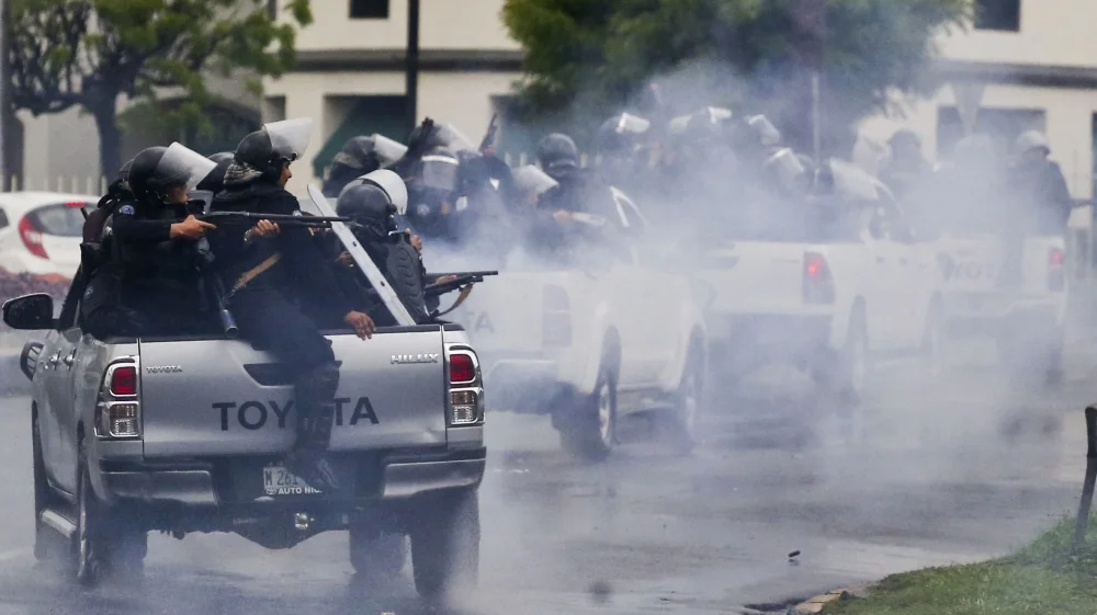 Police shoot at student protesting against Daniel Ortega. (Esteban Felix/AP.)