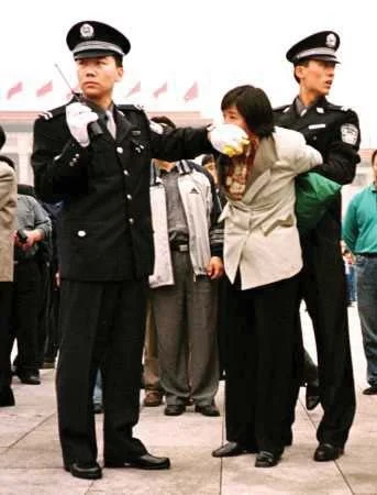 A Falun Gong practitioner is arrested in Beijing. (ClearWisdom.net/Wikimedia Commons)