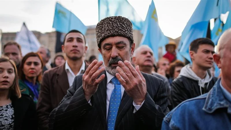 A man at a rally commemorating 70 years since the forced expulsion of Crimean Tatars by the Soviet Union. (Roman Pilipey/EPA)