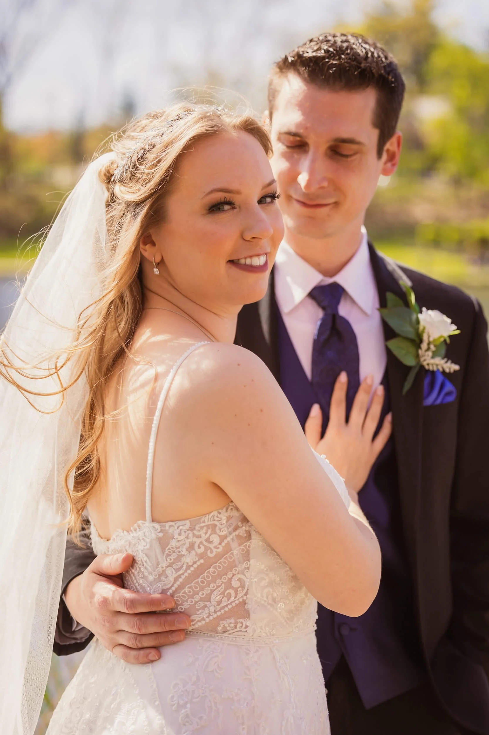 wedding photographer in Houston Texas TX - bride looking at camera while groom admires her.jpg