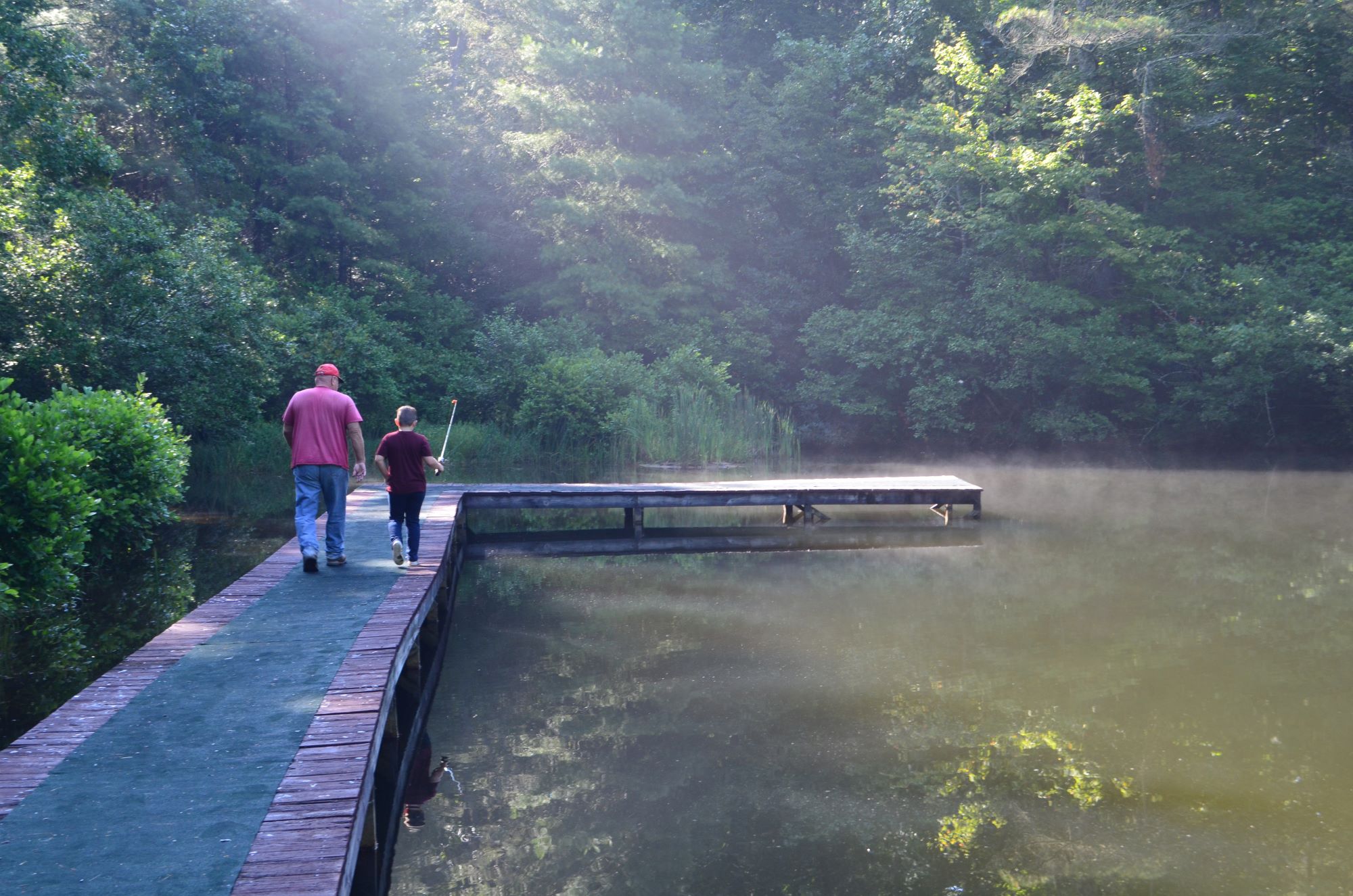 Steve and Jackson on dock.JPG