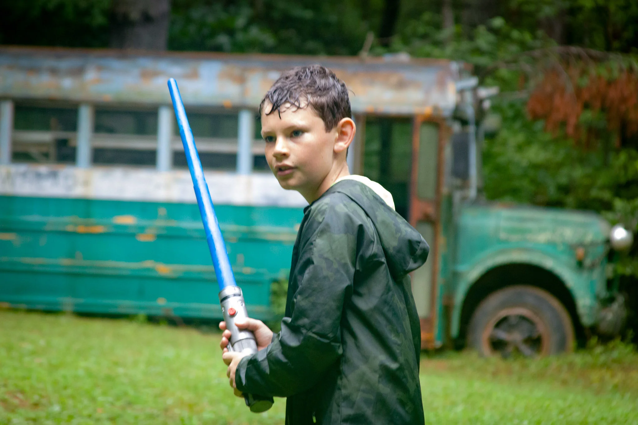 Boy with lightsaber for game at Camp Arrowhead. 