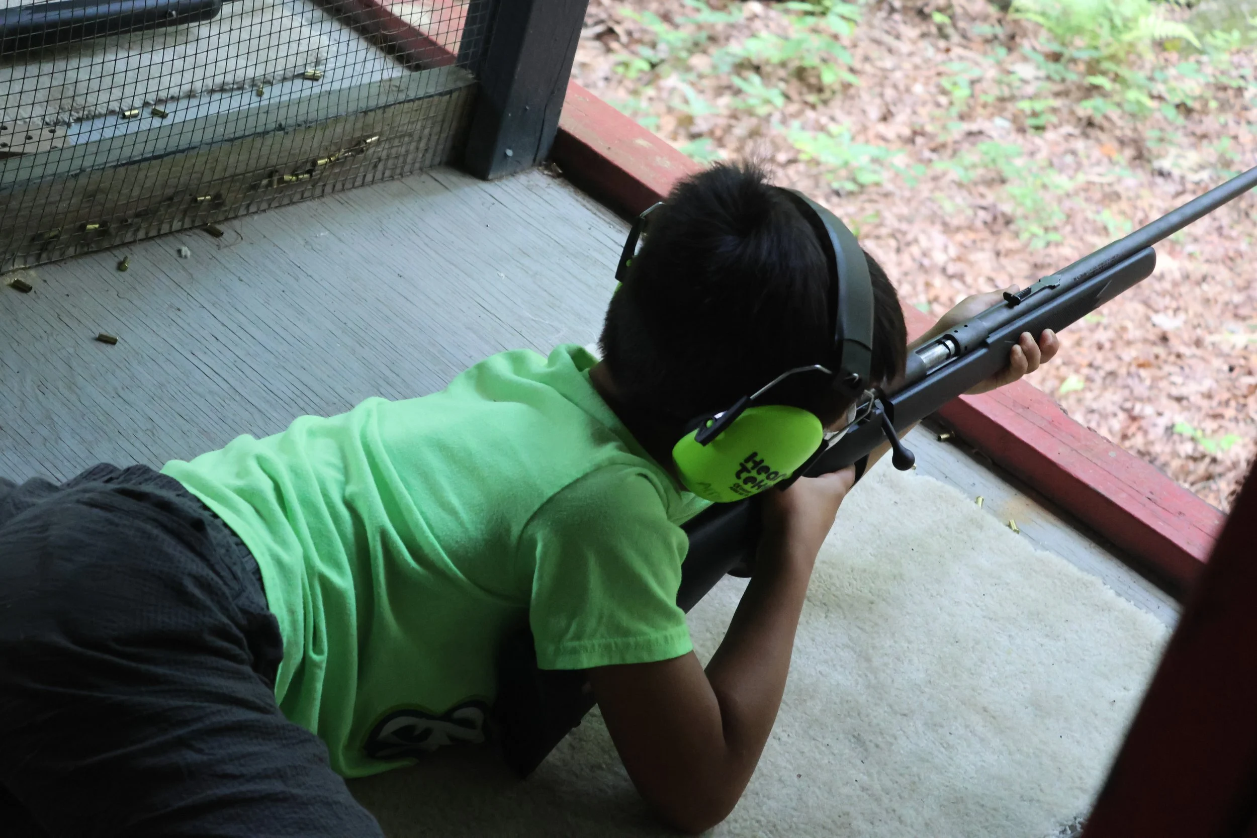 Camper takes aim at the Camp Arrowhead Rifle Range safely. 
