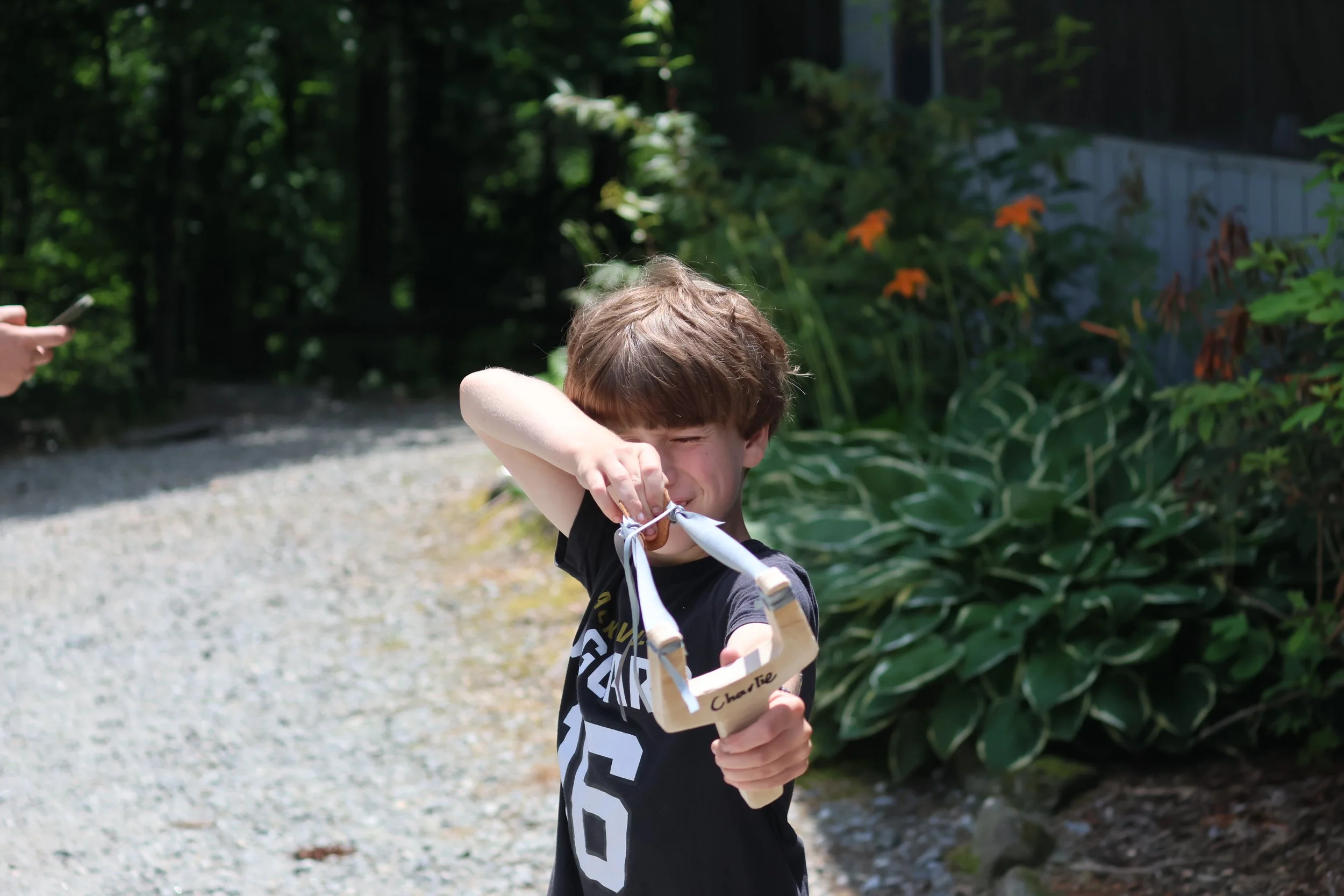 Camper at Arrowhead practicing his handmade Slingshot.
