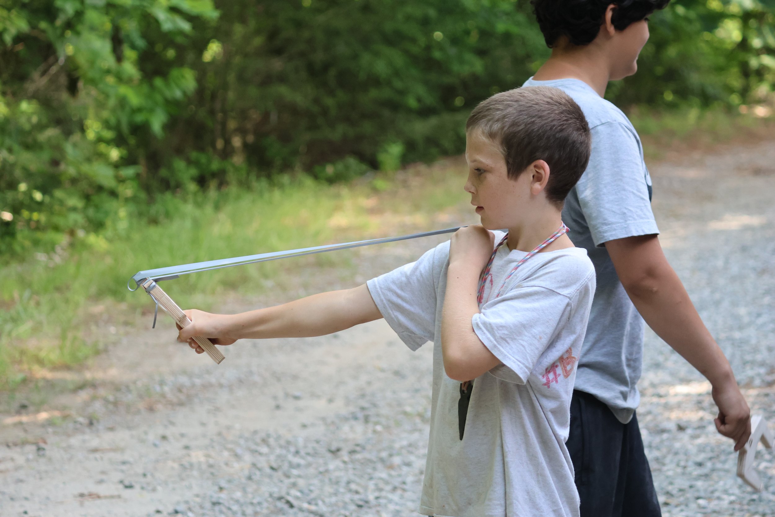 Camper with his slingshot in North Carolina. 
