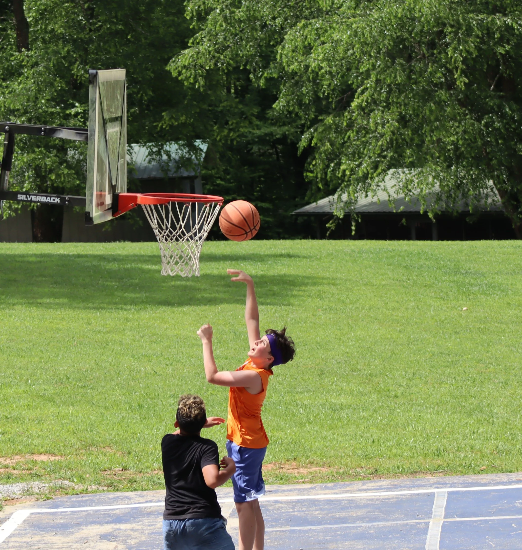 Camper going for a Layup on the Camp Basketball Court in North Carolina.