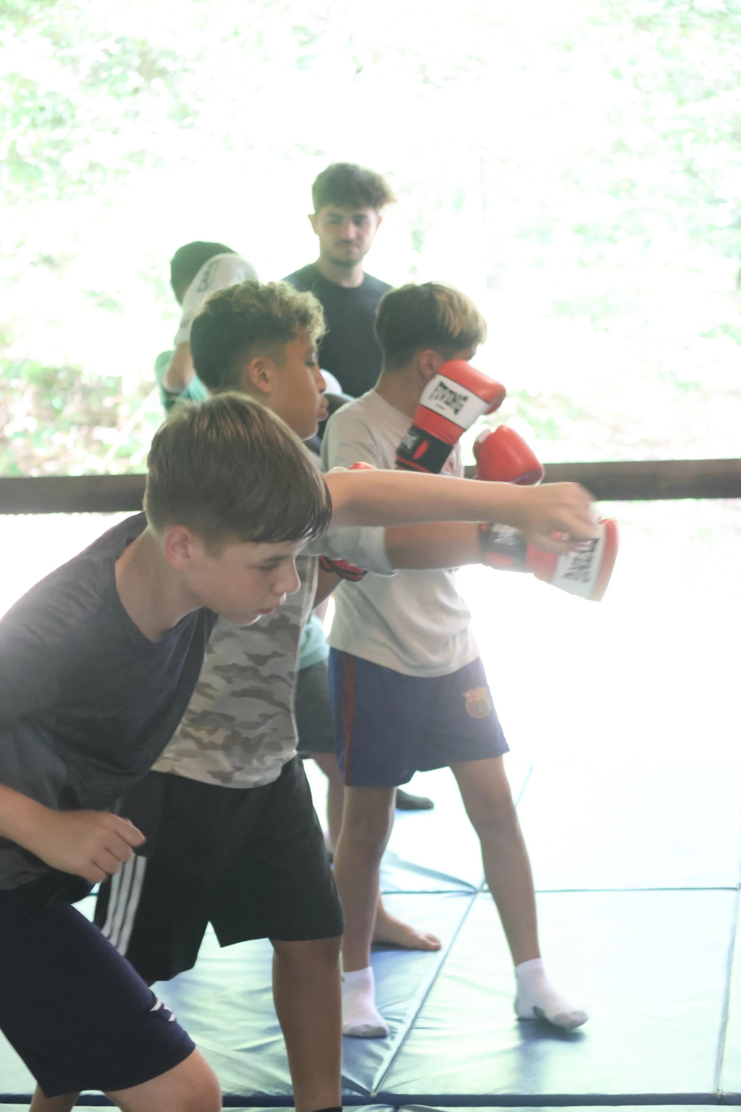 Campers learning the basics of boxing in the Dojo at camp. 