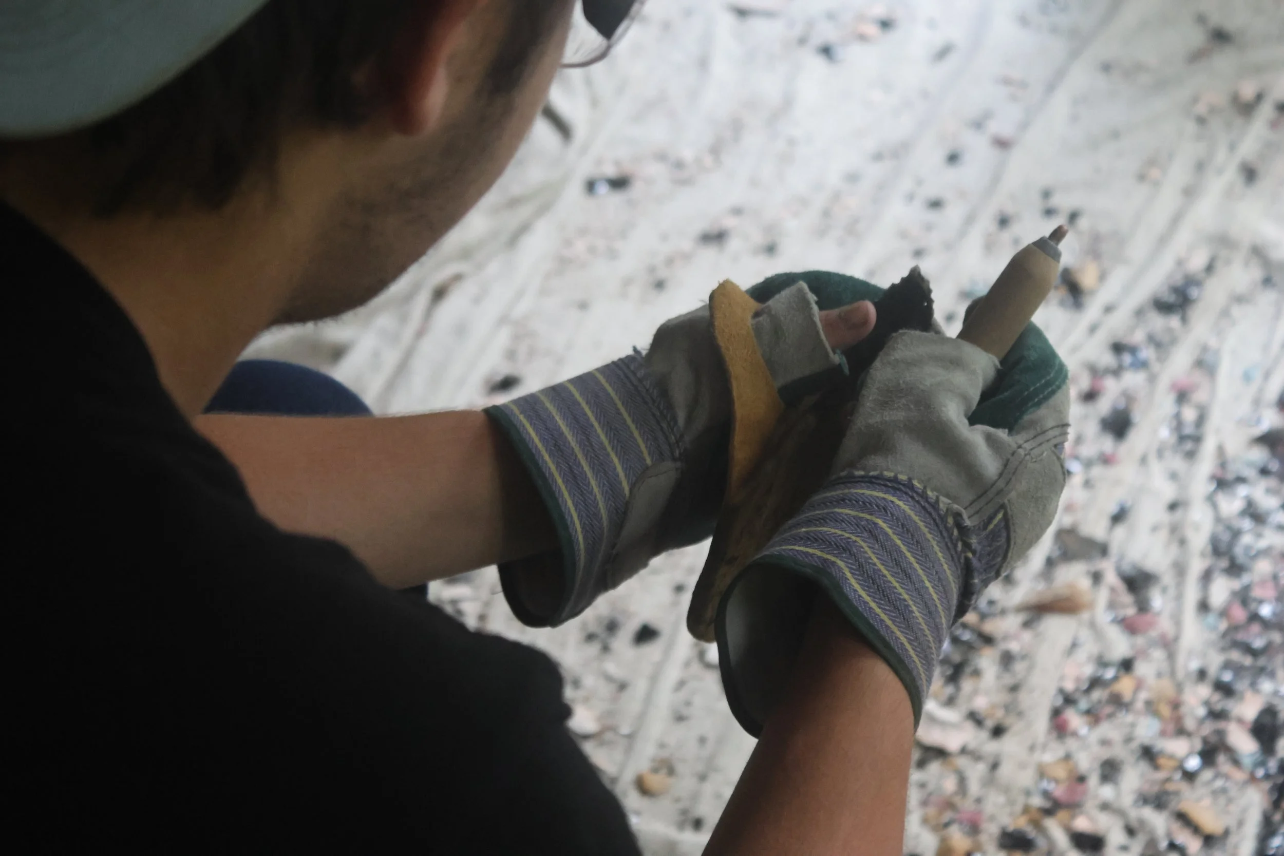 Camper works on his flint knapping arrowhead at Sleepaway camp in NC. 